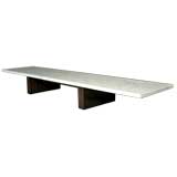 Long and low rosewood coffee table with thick marble top Long and low rosewood coffee table with thick marble top