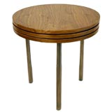 Set of three round walnut and chrome side tables in one