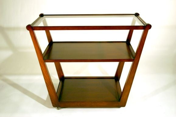 Walnut rolling tea cart or bar cart with glass top by Edward Wormley.