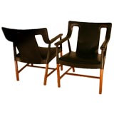 Rare pair of armchairs in teak and leather
