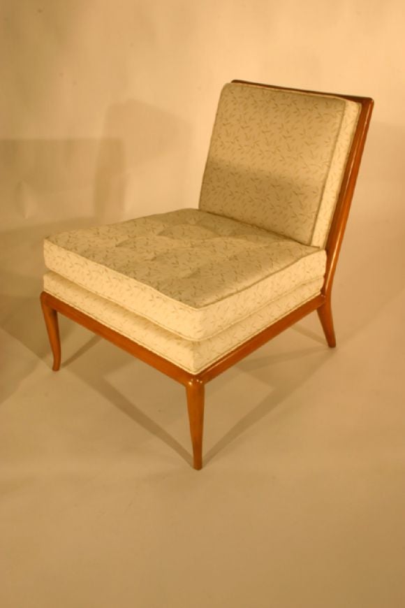 The now classic pair of slipper chairs designed by T.H. Robsjohn-Gibbings for Widdicomb.  Recently upholstered in silk.