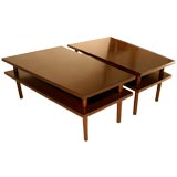 Pair of large tiered trapezoidal occasional tables Pair of large tiered trapezoidal occasional tables