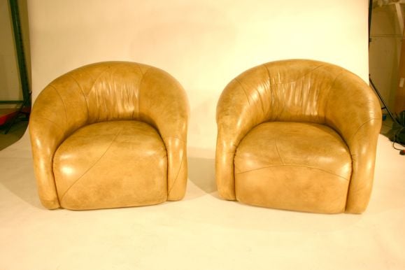 These organically shaped patchwork leather lounge chairs and ottoman are soft and comfortable.  Seat depth: 24