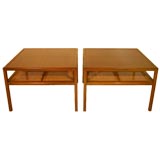 Pair of walnut side tables with inset mahogany panels by Baker