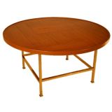 Round teak coffee table with brass base by Edward Wormley/Dunbar