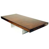Burled wood coffee table with chrome base by Milo Baughman