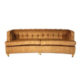 Curved Dunbar sofa with tufted back and arms