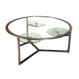 Round Italian glass-top chrome coffee table