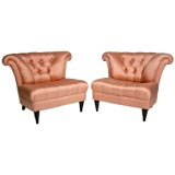 Pair of large scale tufted scalloped back lounge chairs