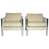 Pair of white chenille armchairs with solid aluminum posts