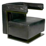 Leather armchair with bronze colored base