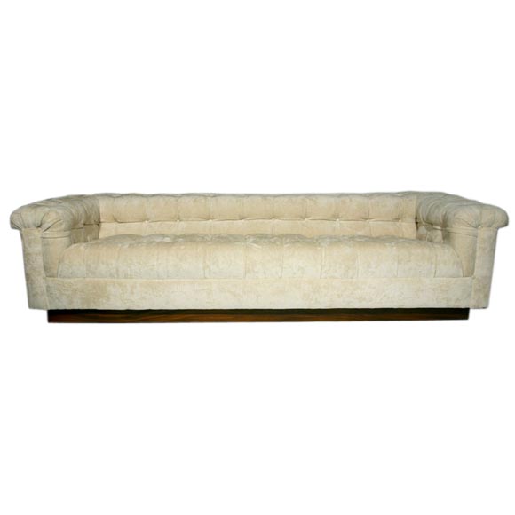 Dunbar tufted chenille sofa with mahogany plinth base