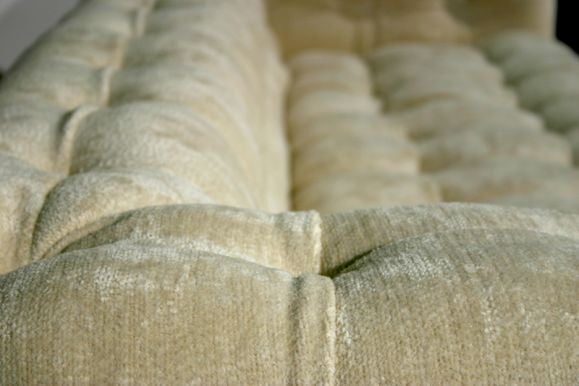 Mid-20th Century Dunbar tufted chenille sofa with mahogany plinth base