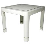 Square grasscloth breakfast table with brass inlay