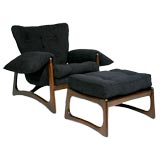 Sculpted walnut base chair and ottoman by Craft Associates