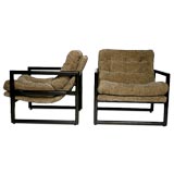 Set of two wooden lounge chairs with heavy chenille fabric