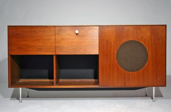 Walnut and Porcelain Thin Edge stereo cabinet by George Nelson<br />
Case lifts up from the top and front for storage of electronic components.