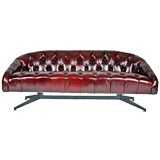 Tufted leather sofa with steel base by Ward Bennett