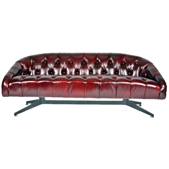 Tufted leather sofa with steel base by Ward Bennett