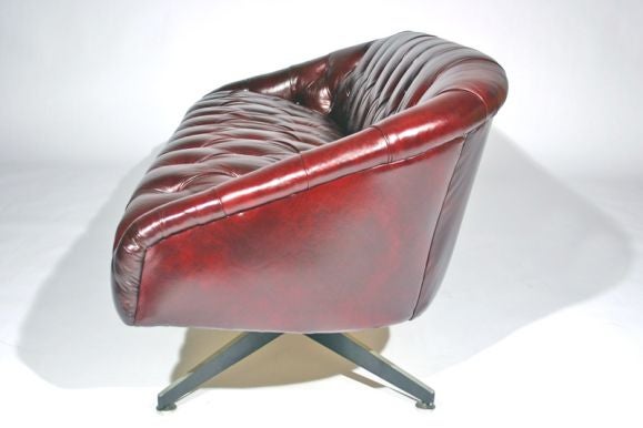 American Tufted leather sofa with steel base by Ward Bennett
