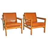 Pair of Borge Mogensen leather and oak arm chairs