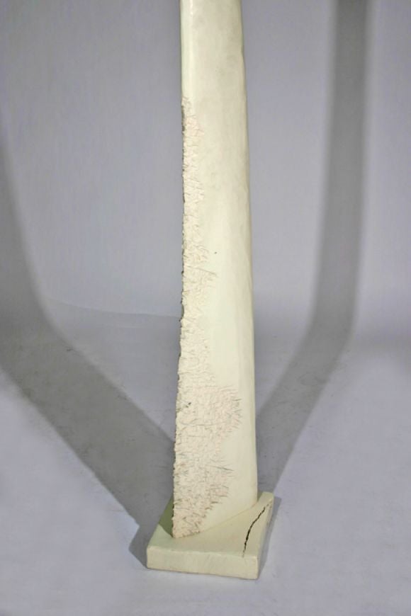 Totemic wooden sculpture carved and painted white.  Signed 