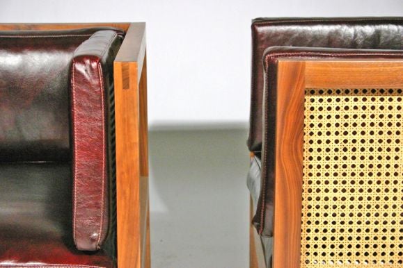 Pair of caned walnut and red leather cube lounge chairs