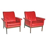 Pair of red leather and rosewood arm chairs by Finn Juhl