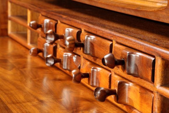 Massive rolltop sculpted walnut and mahogany desk designed and executed by Craftsman Federico Armijo in 1972.  This example is one of three and was commissioned for the Harold Price, Jr. home designed by Frank Lloyd Wright in Paradise Valley, AZ.