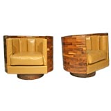 Laminated walnut and leather swivel tub chairs