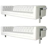 Pair of white leather tufted chrome sofas by Milo Baughman