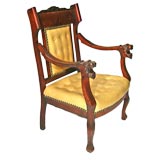 Antique lion's head leather and wooden arm chair