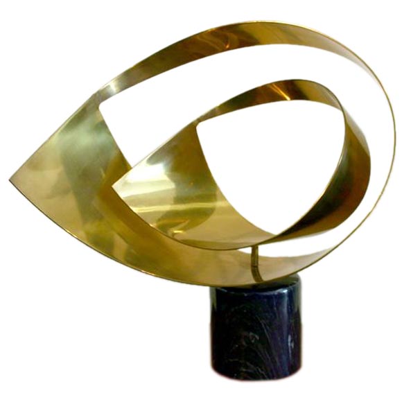 Brass ribbon sculpture by Curtis Jeré