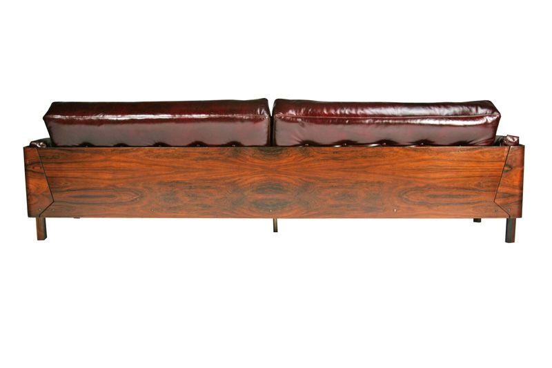 Brazilian Rosewood Case Sofa  in oxblood leather by L'Atelier