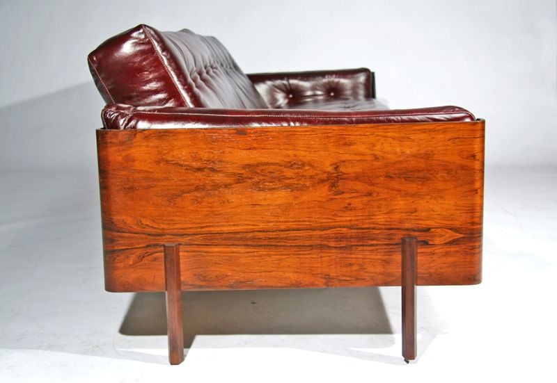 Rosewood Case Sofa  in oxblood leather by L'Atelier 1