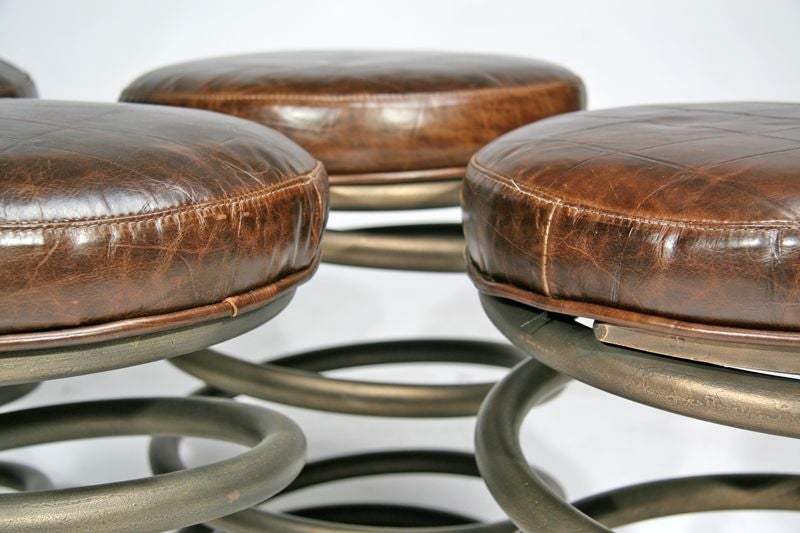 American Pair of coiled bronze and faux crocodile leather stools