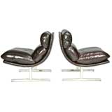 Pair of sloped leather and steel lounge chairs by Kip Stewart