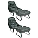 Pair of black leather and chrome lounges and ottomans