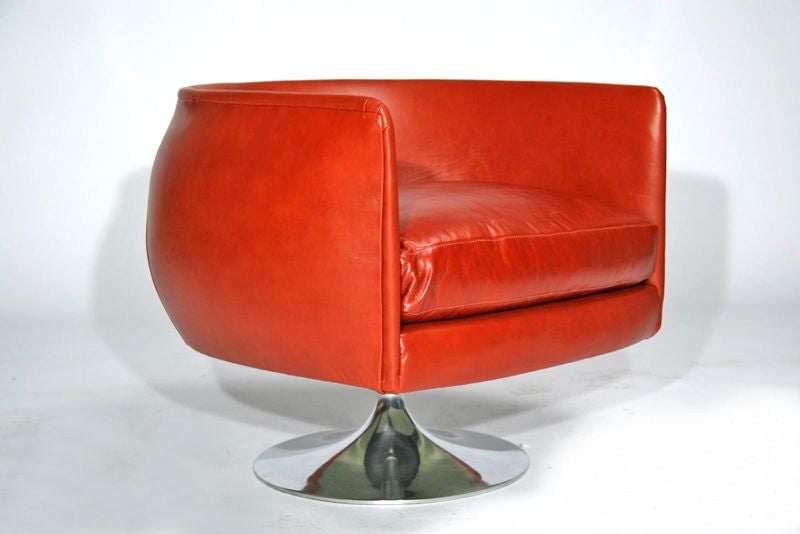 Pair of lounge chairs upholstered in red leather on polished aluminum bases. <br />
<br />
Seat Depth: 20