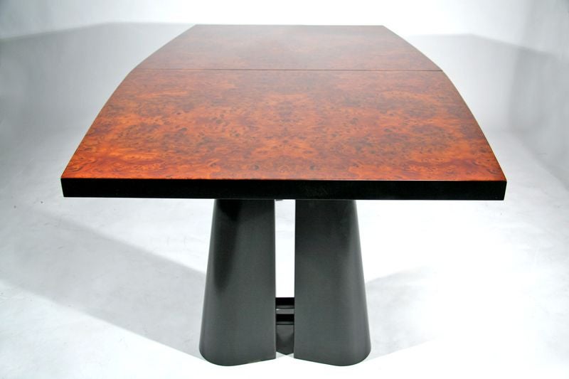 A dining table in exotic amboyna burl and black lacquer, made by Oscar Dell'Arredamento. Dining table available with one leaf: 19.5