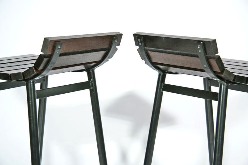 Bar stools with black powder coated steel bases and finished mahogany slats. Available in custom finishes and in a variety of woods. Please see other listings for choices. Price below is per stool.

Seat measures 14