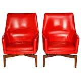 Pair of leather and walnut lounge chairs by Jens Risom