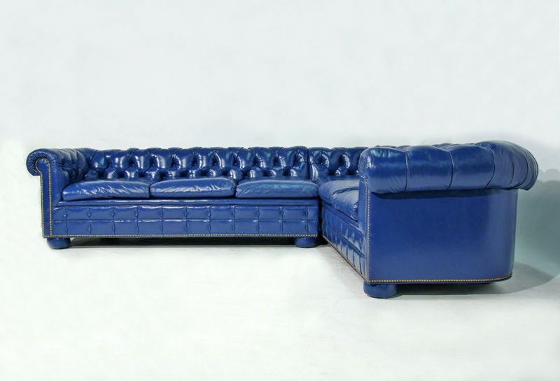 Beautiful blue leather tufted chesterfield sofa with leather wrapped feet.<br />
<br />
Seat depth: 23
