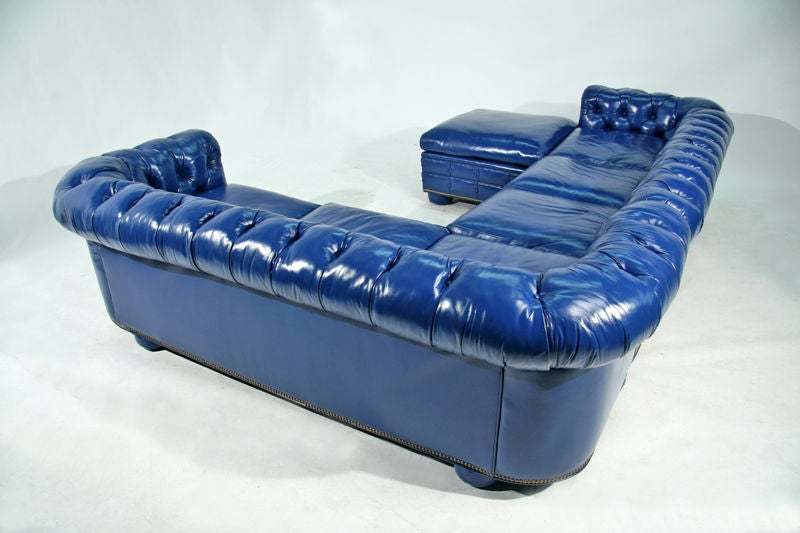 Bright blue leather chesterfield sectional sofa with ottoman 1