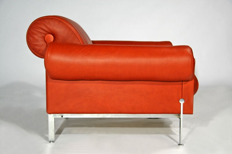 Burnt orange leather and steel arm chairs by Maison Jansen