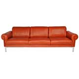 Burnt orange leather and steel sofa by Maison Jansen