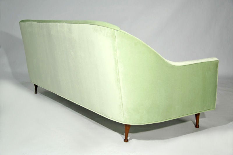 Mid-20th Century A celery velvet curved sofa by Paul McCobb