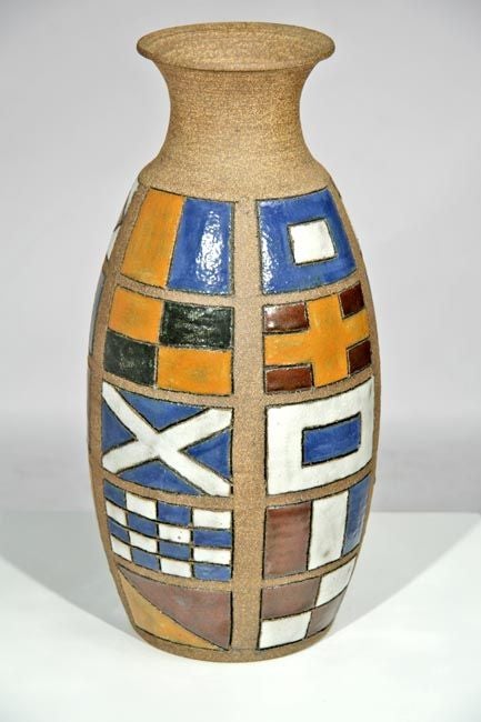 Pair of oversized stoneware vases with geometric pattern glazing by Brent Bennett.  The patterns appear to be nautical flags.

Many pieces are stored in our warehouse, so please give us a call at (323) 463-4434 or email us at