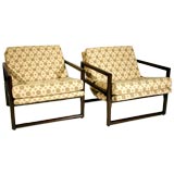 Pair of walnut and upholstered lounge chairs by Milo Baughman