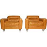 Pair of oversized caramel leather lounge chairs
